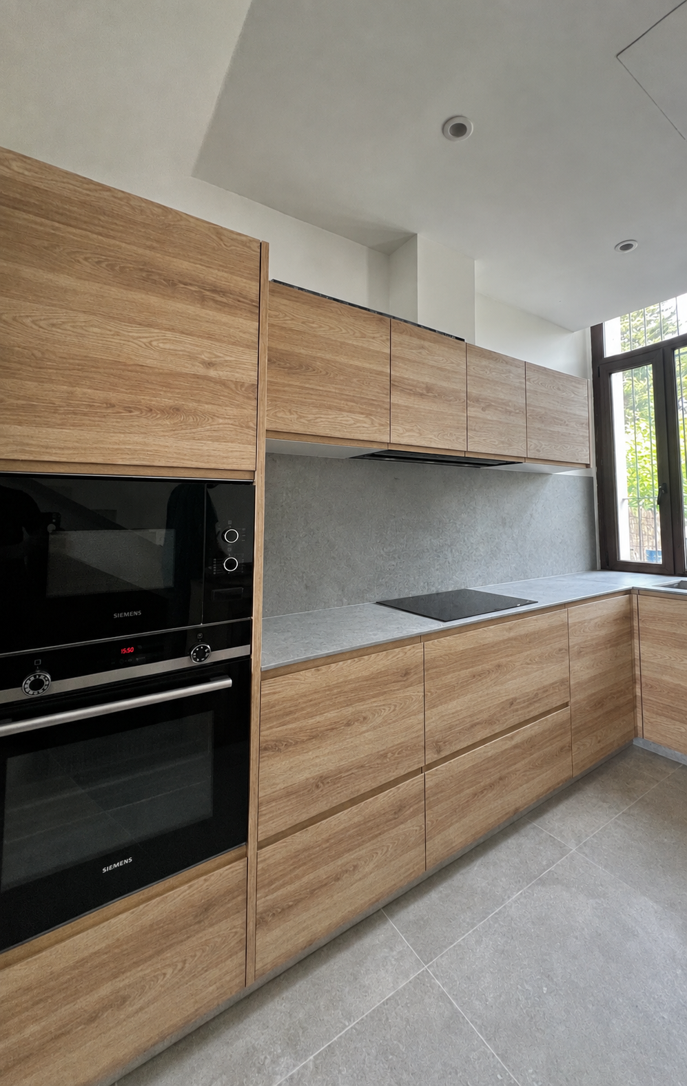 Light oak kitchen with a stone worktop and splashback, Nueva Andaluc&iacute;a